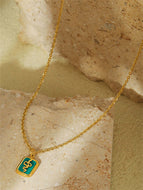 Gold-tone Necklace with Green Snake Pendant