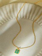 Gold-tone Necklace with Green Snake Pendant